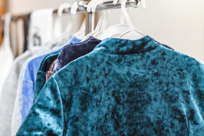 https://www.shutterstock.com/image-photo/hanging-velvet-velour-clothes-on-rack-1045146094